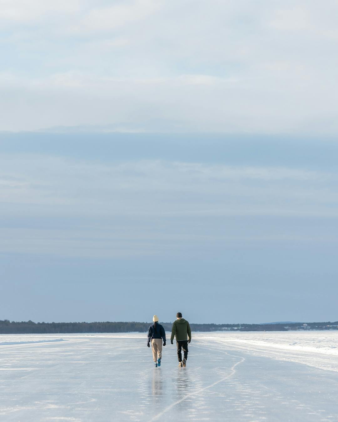 Two people walking on ice with Icebug Rover BUGrip GTX